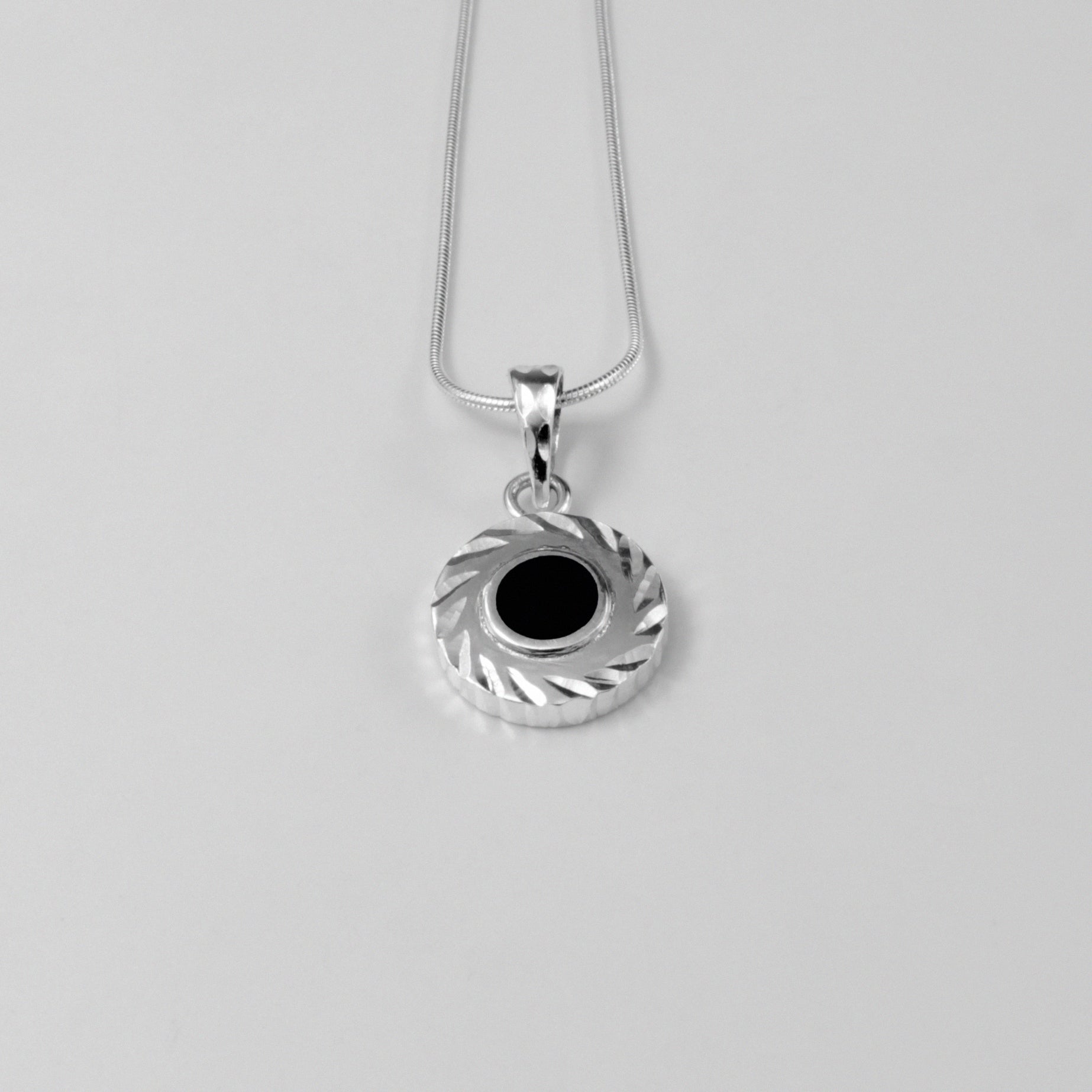 Midnight Eclipse Pendant - A stunning 925 sterling silver pendant by GetTheJuice, showcasing an intricate midnight eclipse motif that blends elegance with celestial allure.