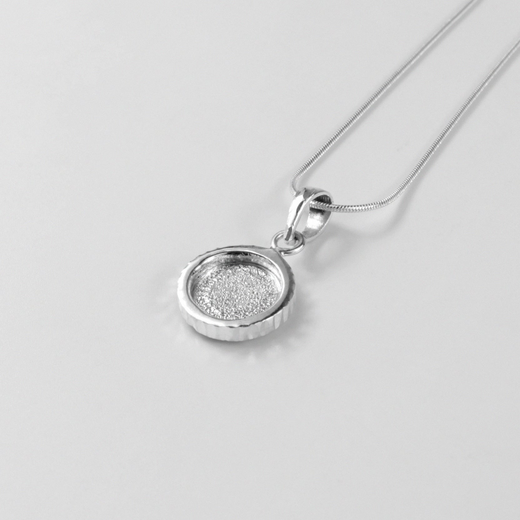 Midnight Eclipse Pendant - A stunning 925 sterling silver pendant by GetTheJuice, showcasing an intricate midnight eclipse motif that blends elegance with celestial allure.