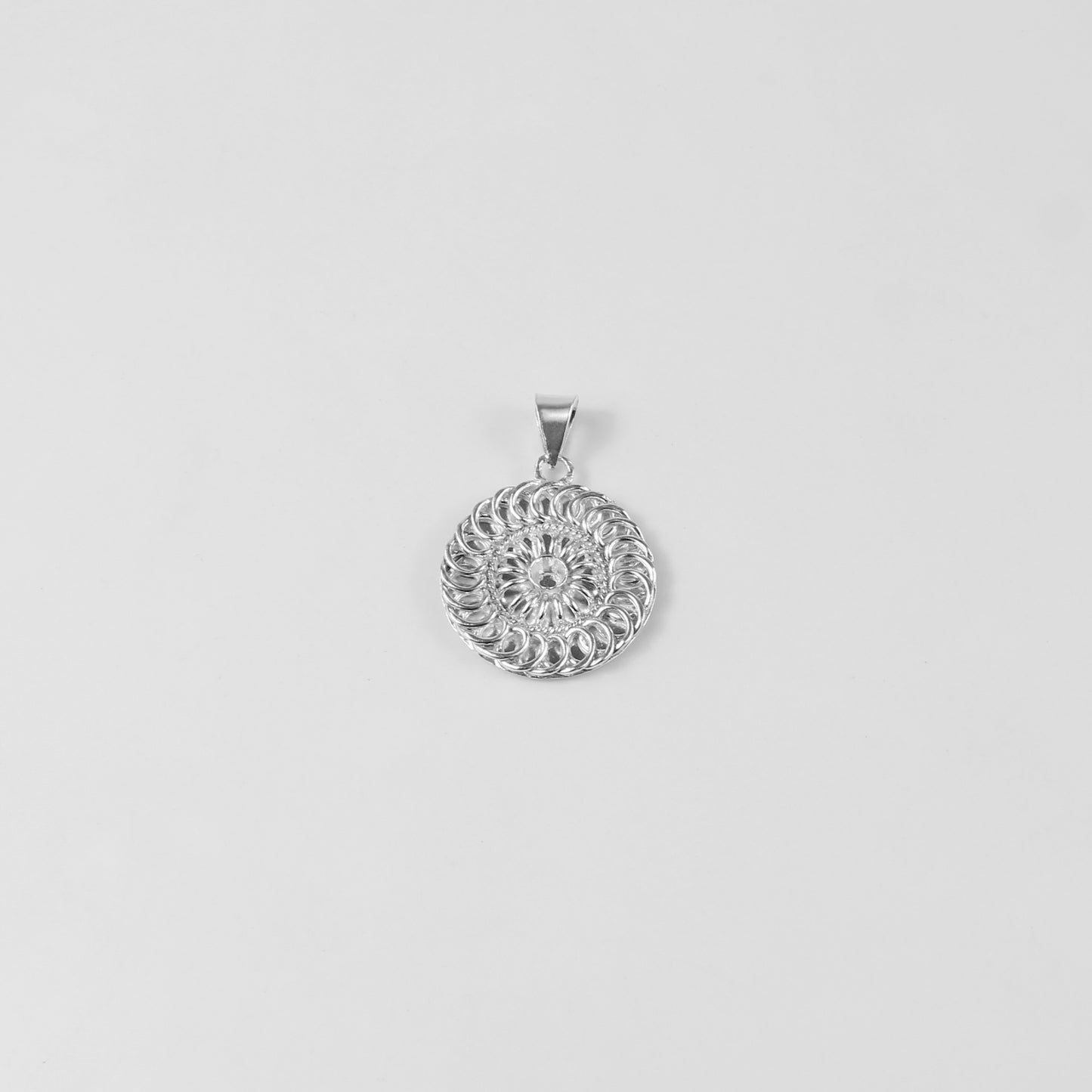 Mystic Whorl Pendant - An elegant 925 sterling silver pendant by GetTheJuice, featuring a mesmerizing spiral design that symbolizes mystery and allure, adding a touch of enigmatic beauty to any look.