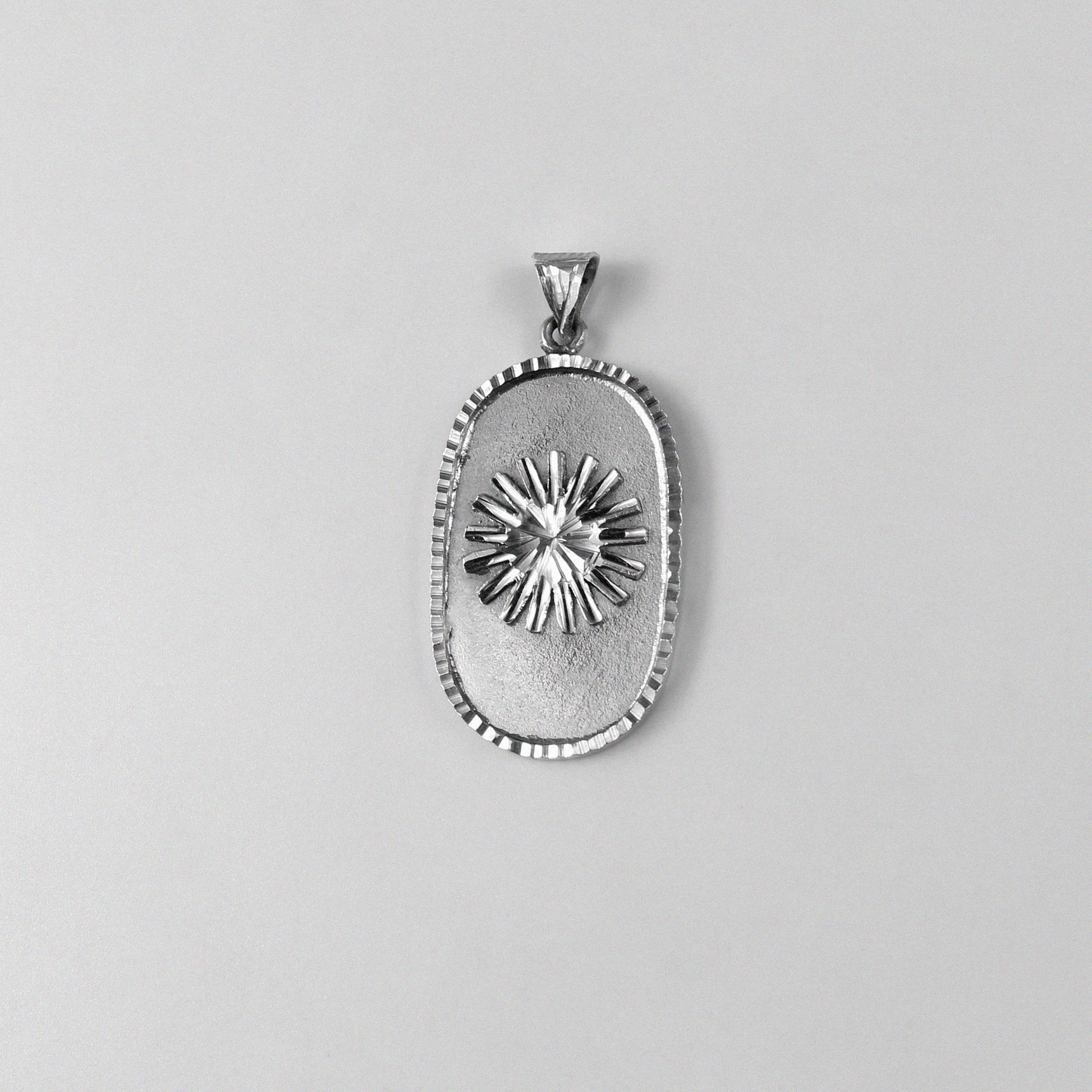 Rectangle Sunshine Pendant - An elegant 925 sterling silver pendant by GetTheJuice, with a refined rectangular design that exudes the vibrant energy of sunshine, making it a brilliant addition to any jewelry collection.