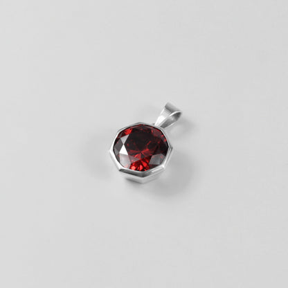 Round Red Pendant - A stunning 925 sterling silver pendant by GetTheJuice, showcasing a radiant red stone in a refined circular setting, perfect for adding a bold splash of color and charm to any outfit.