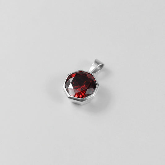 Round Red Pendant - A stunning 925 sterling silver pendant by GetTheJuice, showcasing a radiant red stone in a refined circular setting, perfect for adding a bold splash of color and charm to any outfit.