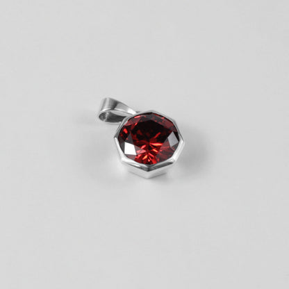 Round Red Pendant - A stunning 925 sterling silver pendant by GetTheJuice, showcasing a radiant red stone in a refined circular setting, perfect for adding a bold splash of color and charm to any outfit.