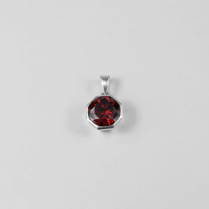 Round Red Pendant - A stunning 925 sterling silver pendant by GetTheJuice, showcasing a radiant red stone in a refined circular setting, perfect for adding a bold splash of color and charm to any outfit.