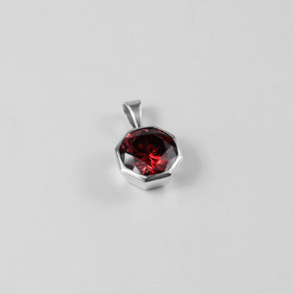 Round Red Pendant - A stunning 925 sterling silver pendant by GetTheJuice, showcasing a radiant red stone in a refined circular setting, perfect for adding a bold splash of color and charm to any outfit.