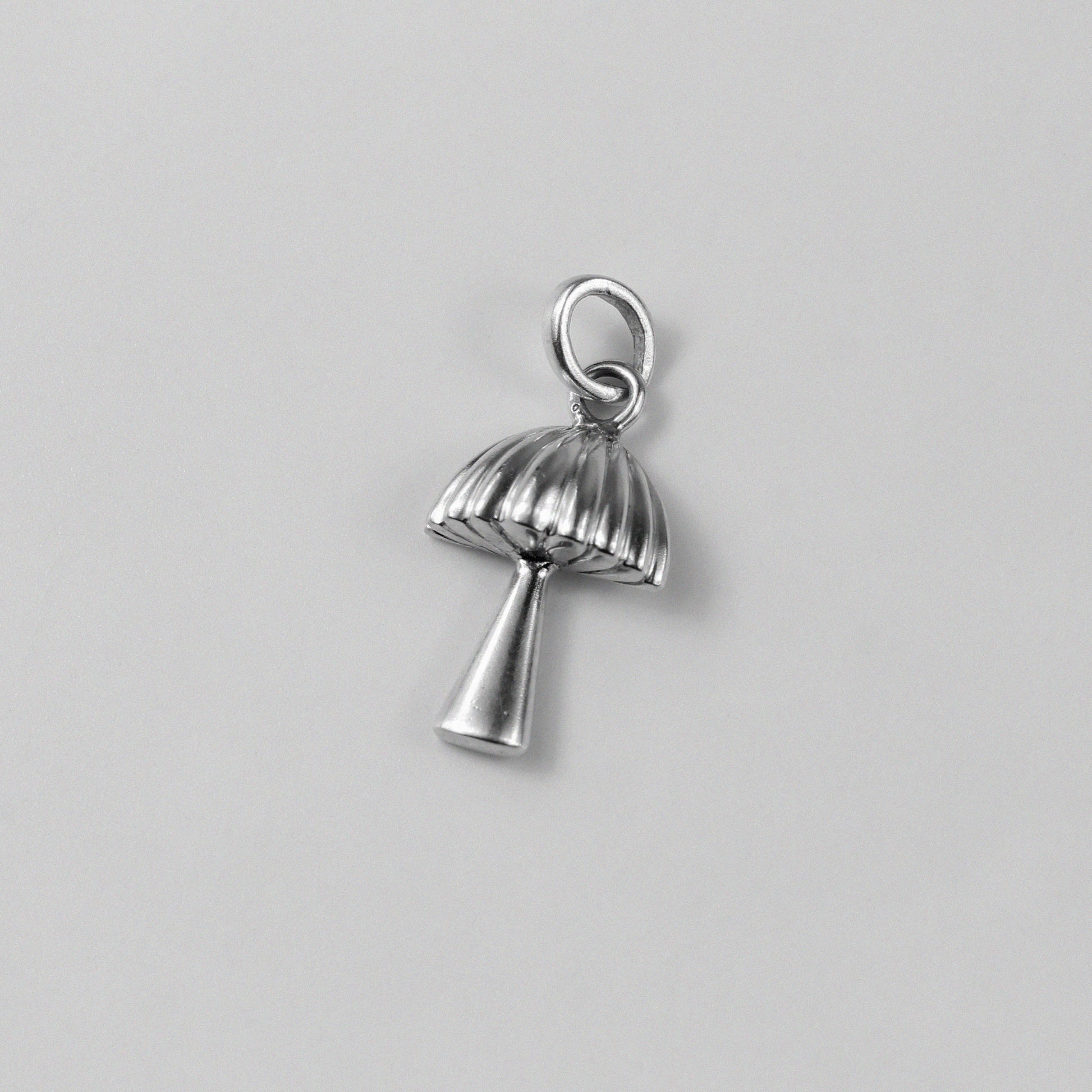 Shroom Pendant - An exquisite 925 sterling silver pendant by GetTheJuice, featuring a whimsical mushroom design that adds a touch of playful elegance and charm to any look.