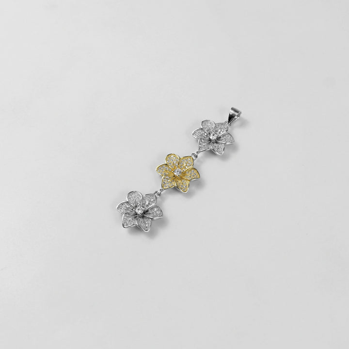 The 'Trinity Bloom' pendant, a graceful piece of 925 sterling silver jewelry, inspired by the beauty of three interconnected flowers representing unity.