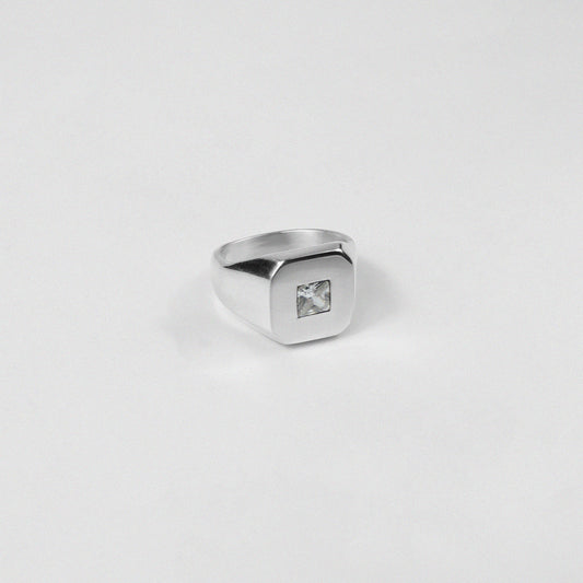 Sterling silver ring stamped '925,' showcasing a sleek baguette-cut gemstone, named 'Baguette Emblem.