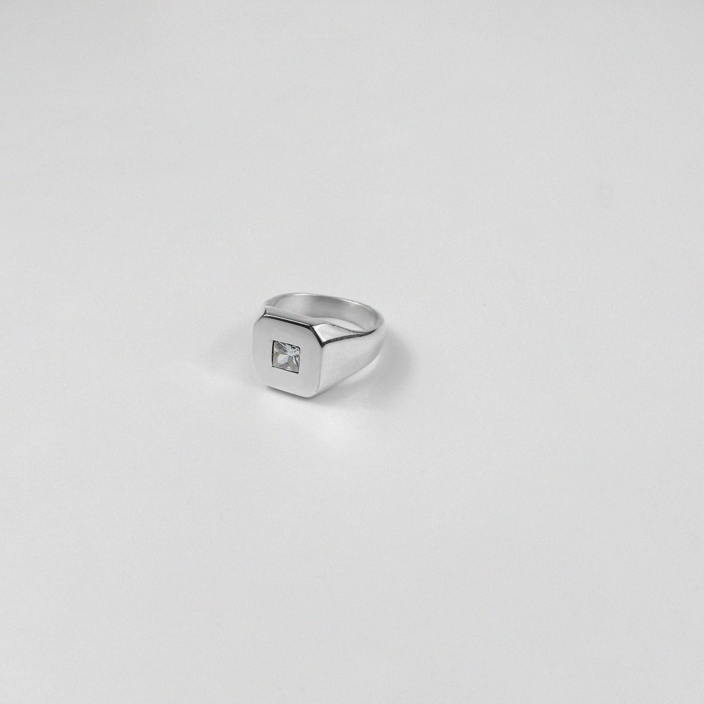 Sterling silver ring stamped '925,' showcasing a sleek baguette-cut gemstone, named 'Baguette Emblem.