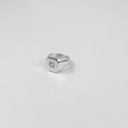 Sterling silver ring stamped '925,' showcasing a sleek baguette-cut gemstone, named 'Baguette Emblem.