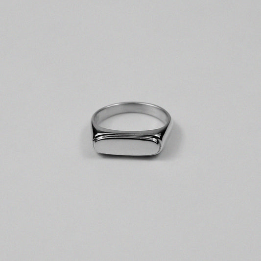 Sterling silver signet ring stamped '925,' featuring a sleek and minimalist design, named 'Blink Signet Ring.