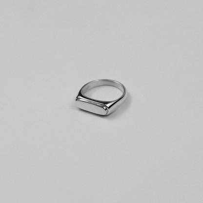 Sterling silver signet ring stamped '925,' featuring a sleek and minimalist design, named 'Blink Signet Ring.