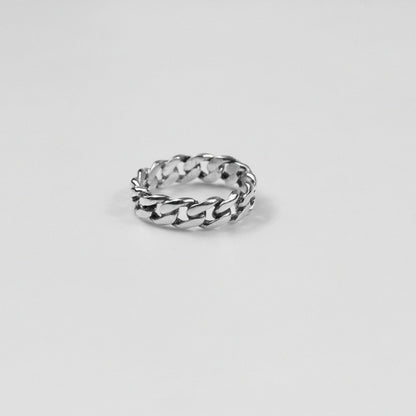 Sterling silver ring stamped '925,' featuring an intricate chain-inspired design, named 'ChainFusion Ring.