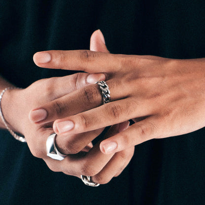 Sterling silver ring stamped '925,' featuring an intricate chain-inspired design, named 'ChainFusion Ring.