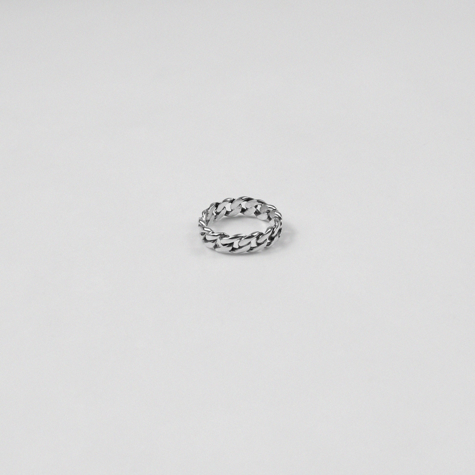 Sterling silver ring stamped '925,' featuring an intricate chain-inspired design, named 'ChainFusion Ring.