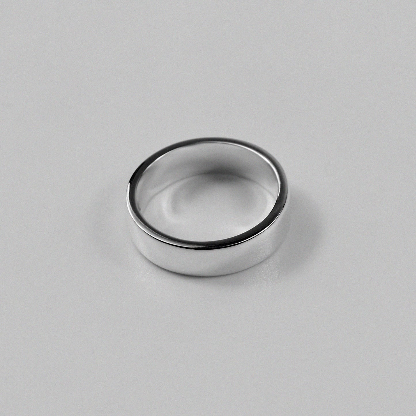 Sterling silver ring stamped '925,' featuring a refined circular design, named 'Circle of Elegance Ring.