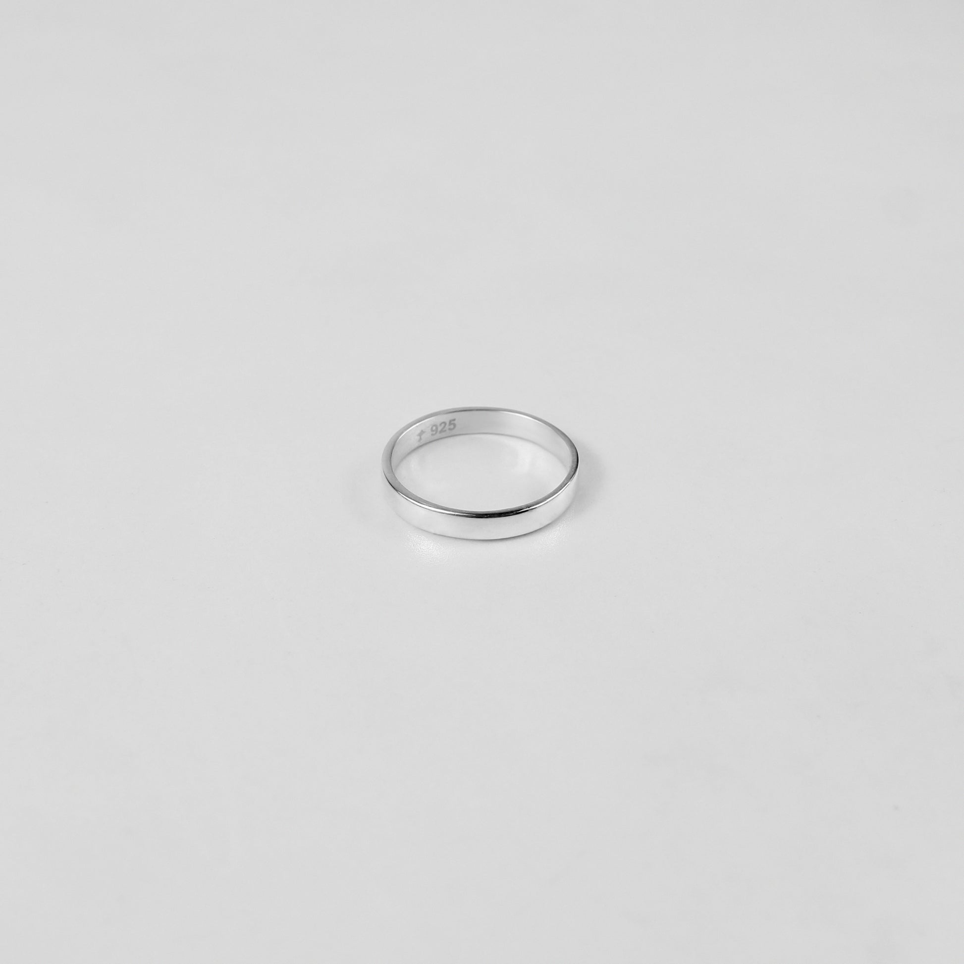 Sterling silver ring stamped '925,' featuring a refined circular design, named 'Circle of Elegance Ring.