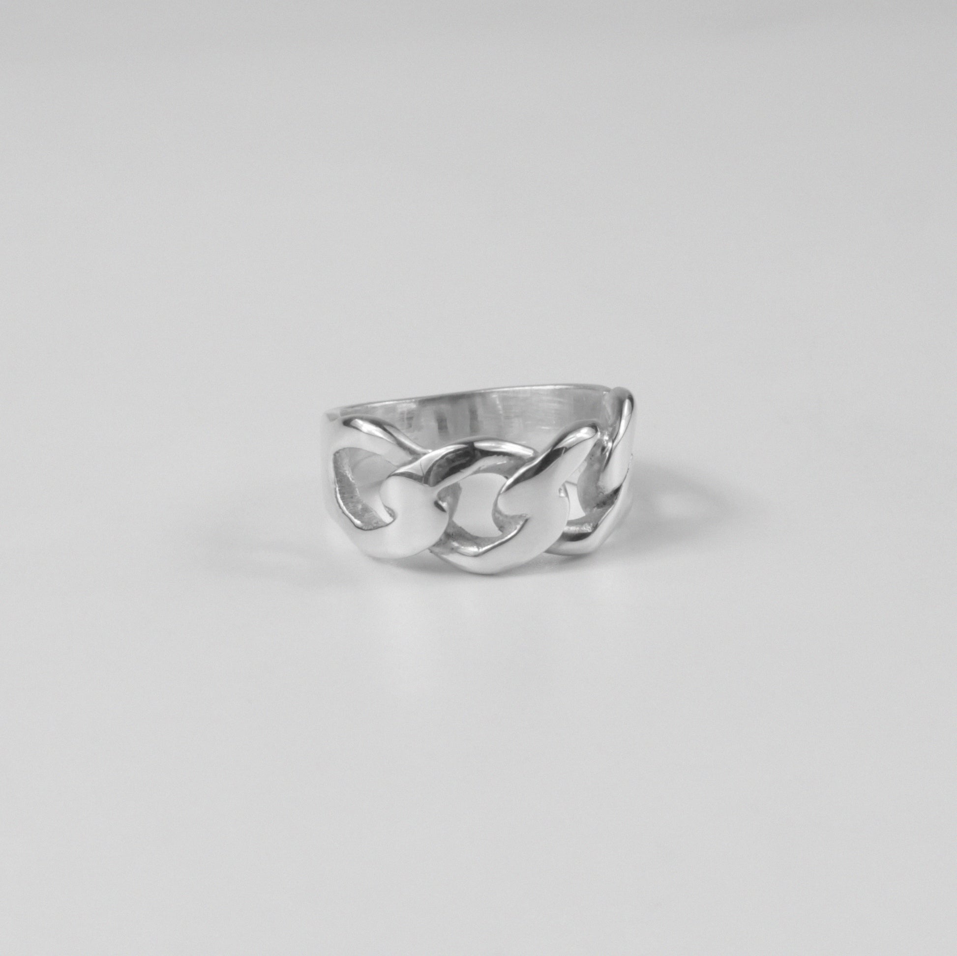 Sterling silver ring stamped '925,' featuring a smooth, curved design inspired by Cuban style, named 'Cuban Curve Ring.