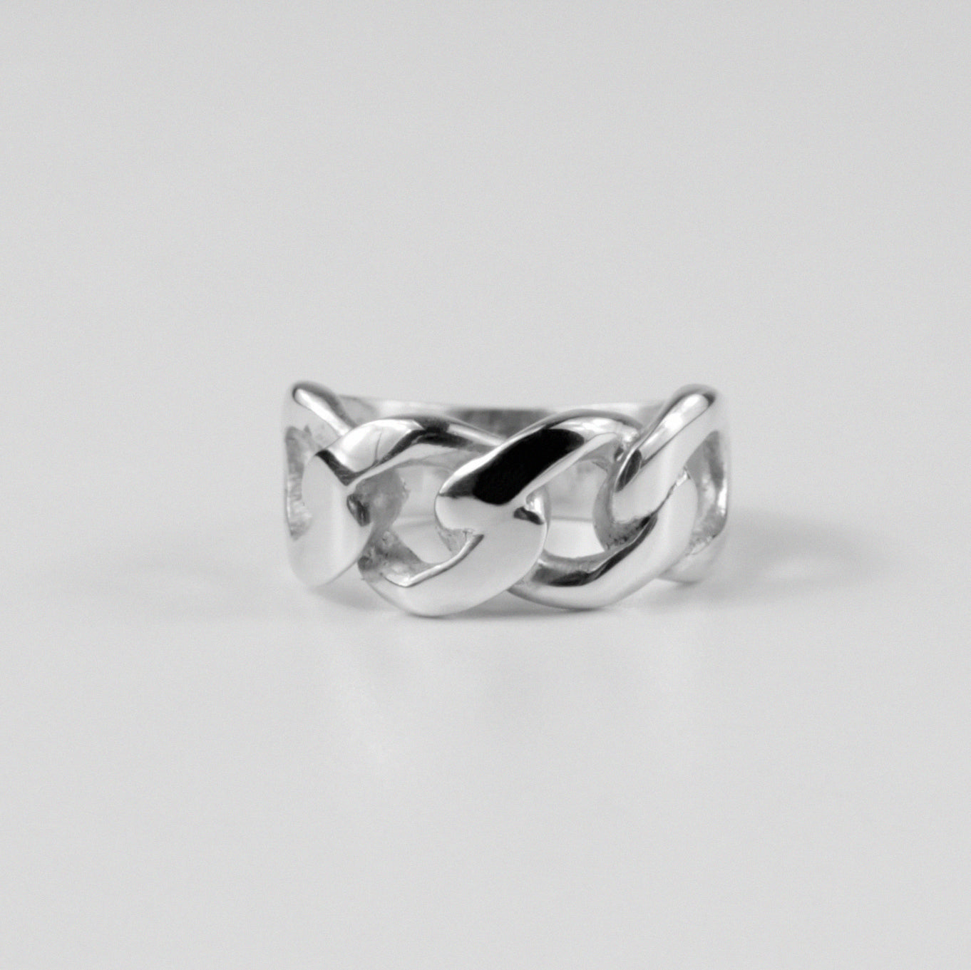 Sterling silver ring stamped '925,' featuring a smooth, curved design inspired by Cuban style, named 'Cuban Curve Ring.