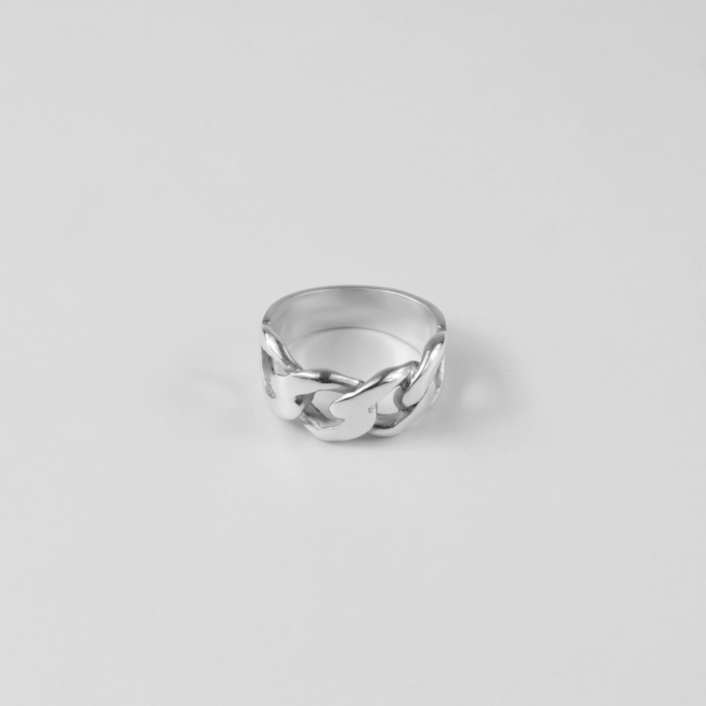 Sterling silver ring stamped '925,' featuring a smooth, curved design inspired by Cuban style, named 'Cuban Curve Ring.