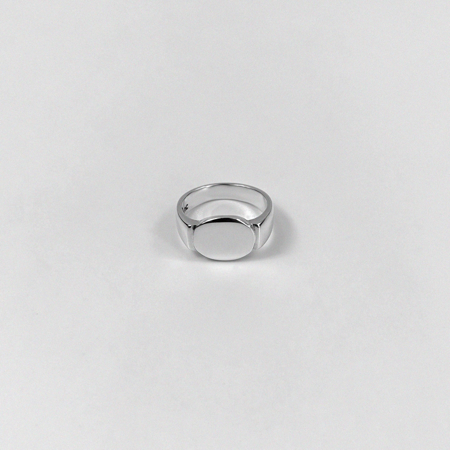 Sterling silver ring stamped '925,' featuring a sleek, circular design inspired by an eclipse, named 'Eclipse Ring.