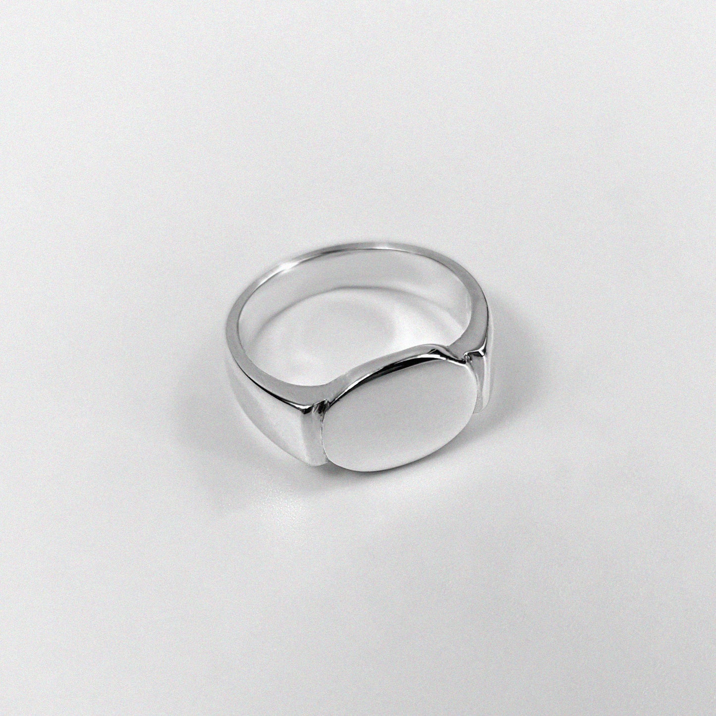 Sterling silver ring stamped '925,' featuring a sleek, circular design inspired by an eclipse, named 'Eclipse Ring.