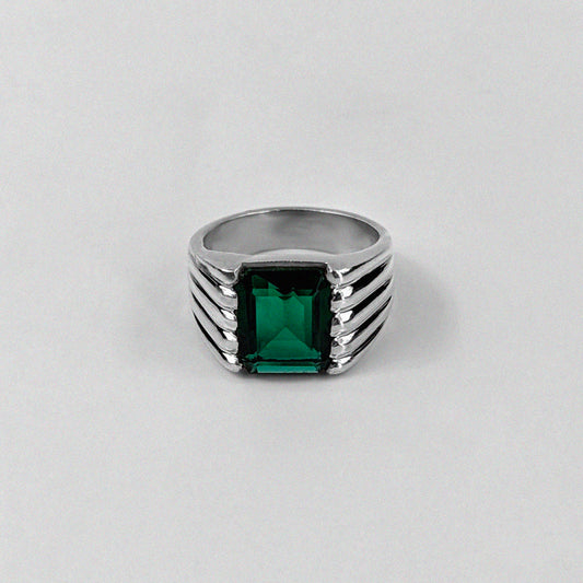 Sterling silver ring stamped '925,' featuring a square emerald gemstone with a radiant shine, named 'Emerald Square Radiance Ring.