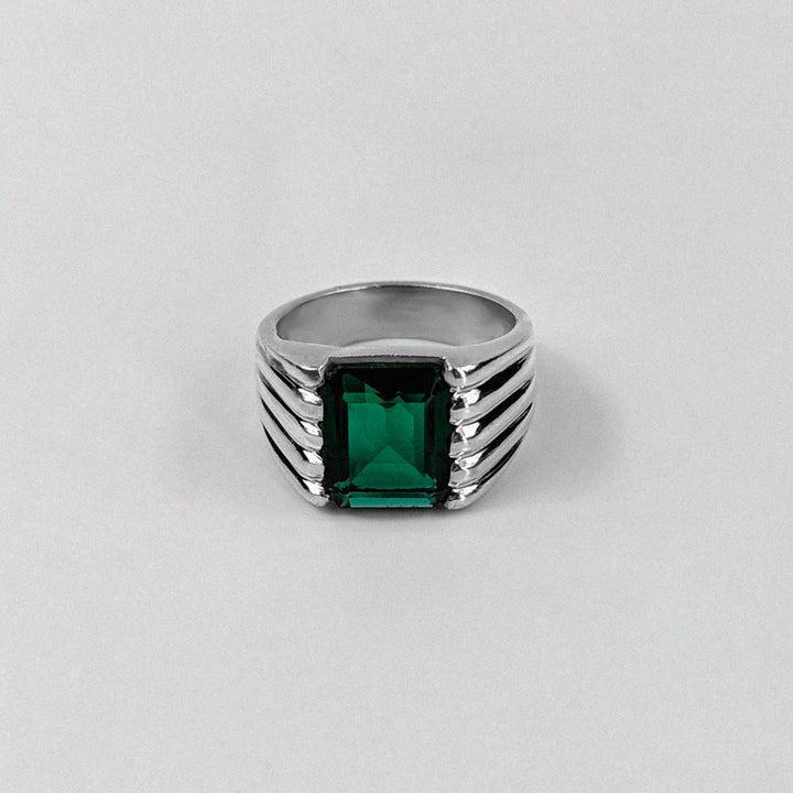 Sterling silver ring stamped '925,' featuring a square emerald gemstone with a radiant shine, named 'Emerald Square Radiance Ring.