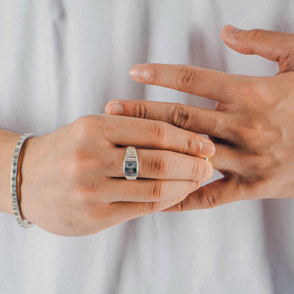 Sterling silver ring stamped '925,' featuring a unique design with faceted details, named 'Facet Fusion Ring.