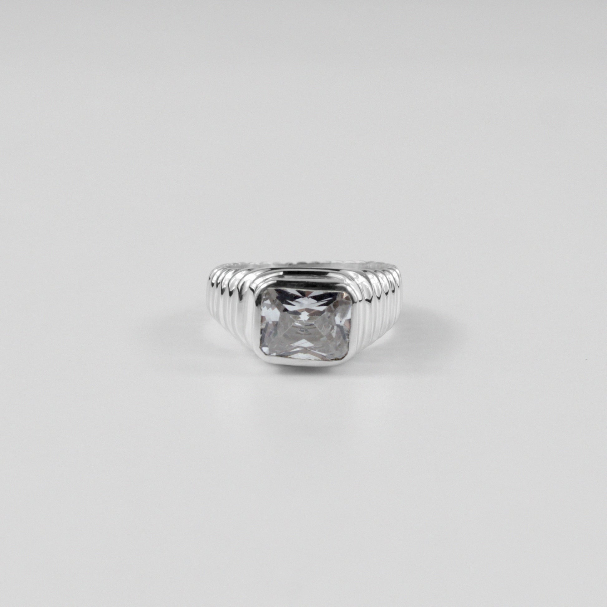 Sterling silver ring stamped '925,' featuring a unique design with faceted details, named 'Facet Fusion Ring.