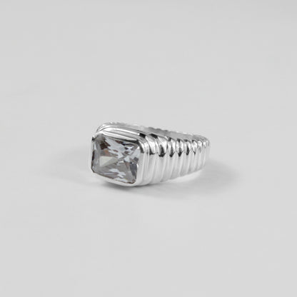 Sterling silver ring stamped '925,' featuring a unique design with faceted details, named 'Facet Fusion Ring.