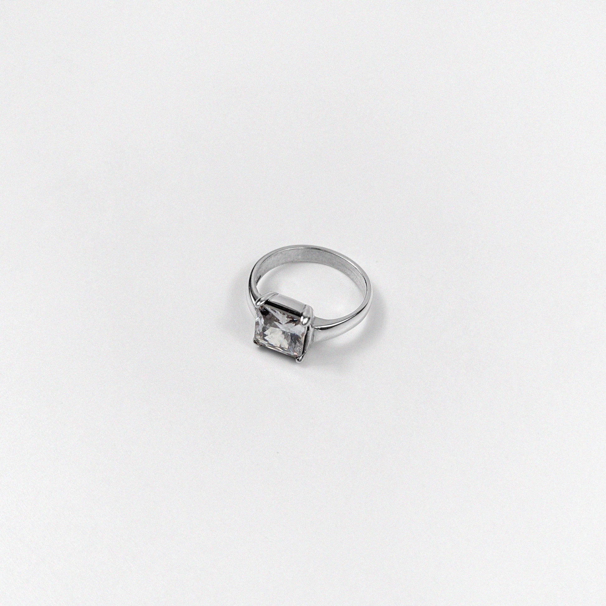 925 sterling silver ring featuring a square design with an ivory gemstone and sparkling accents, named 'Ivory Square Sparkle Ring.