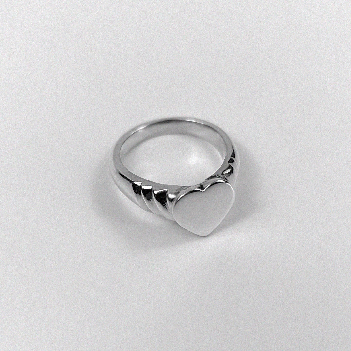 925 sterling silver ring featuring an elegant design symbolizing love and unity, named 'Love's Embrace Ring.