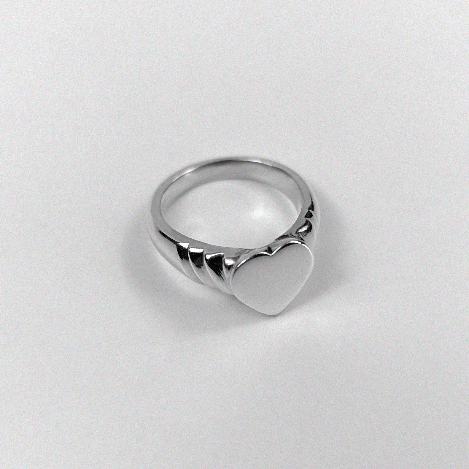 925 sterling silver ring featuring an elegant design symbolizing love and unity, named 'Love's Embrace Ring.