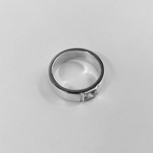 "925 sterling silver ring featuring a sleek design with a white stone centerpiece, named 'Meridian White Stone Ring.'"