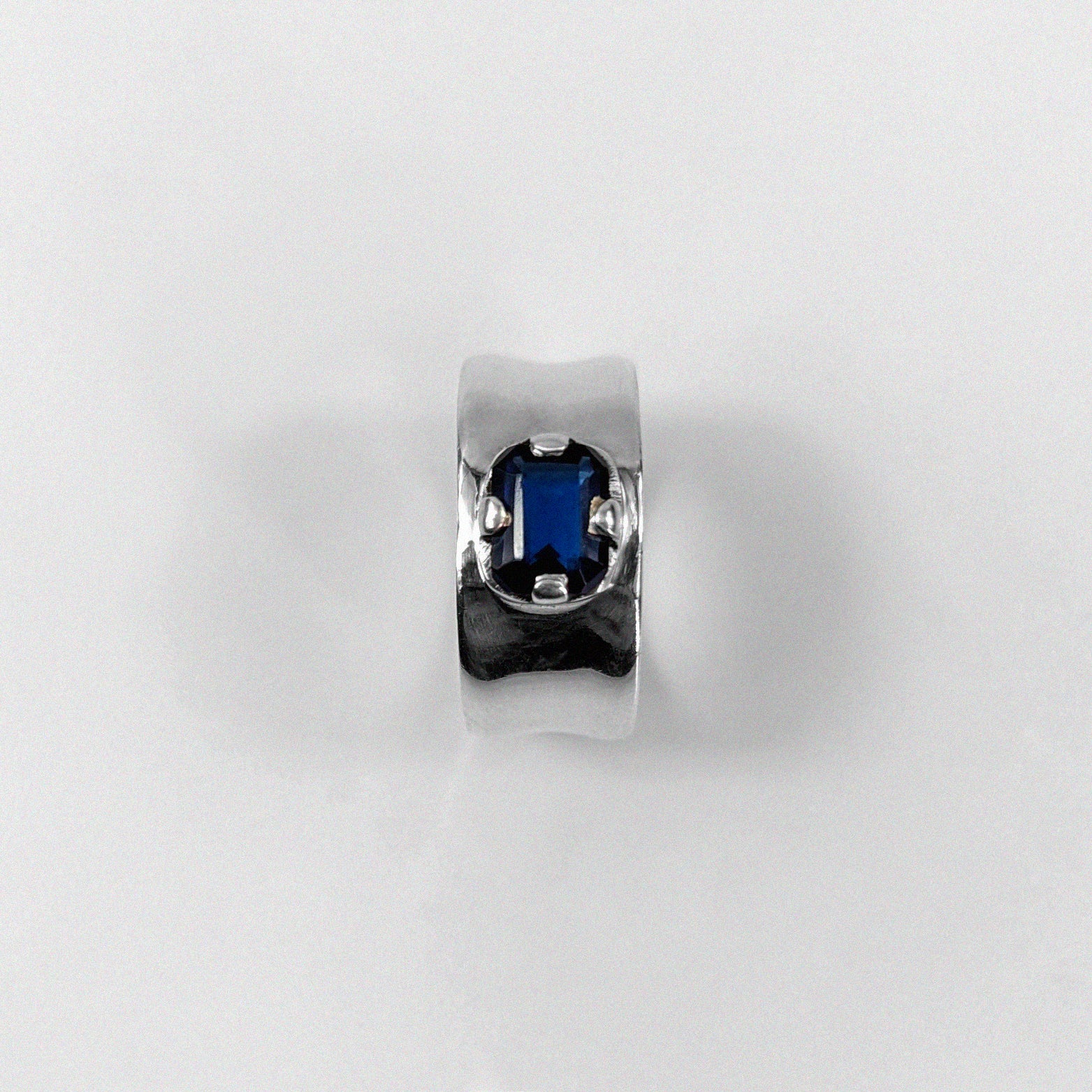 "925 sterling silver ring featuring a deep blue sapphire gemstone, named 'Midnight Sapphire Ring.'"