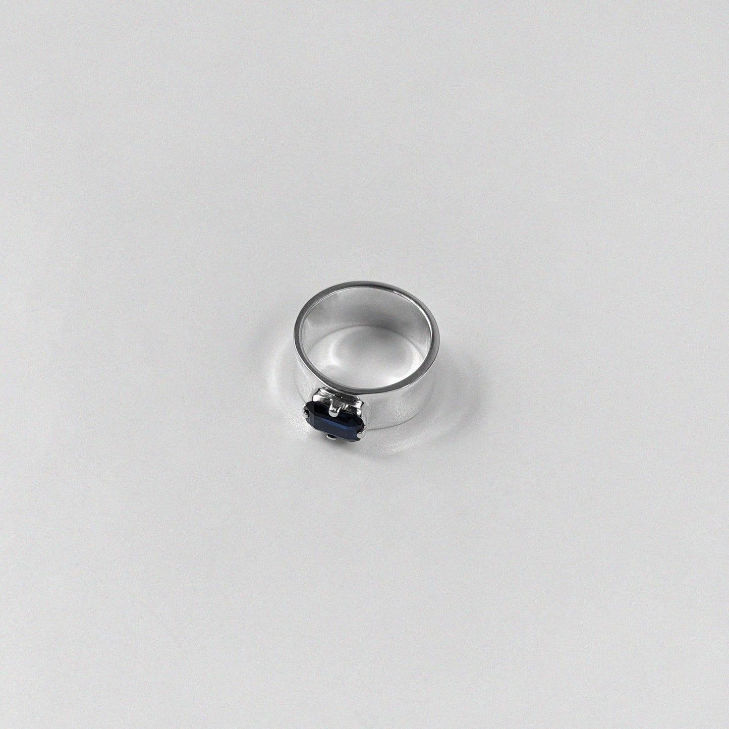 "925 sterling silver ring featuring a deep blue sapphire gemstone, named 'Midnight Sapphire Ring.'"