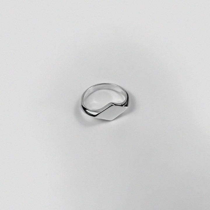 "925 sterling silver signet ring featuring a smooth, polished design, named 'Milley Signet Ring.'"