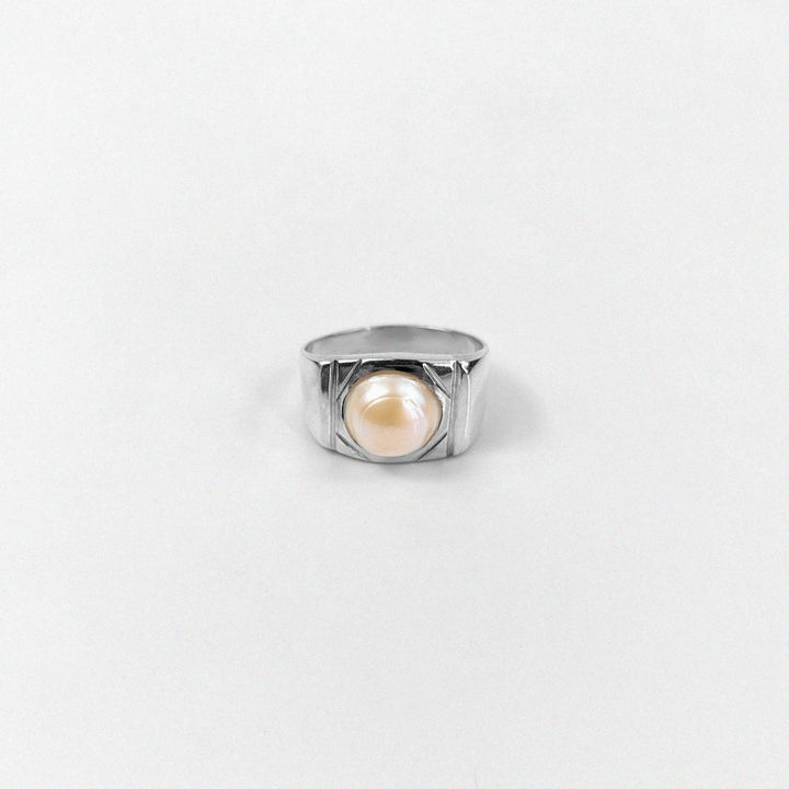 "925 sterling silver ring featuring a cascading design with luminous pearls, named 'Pearl Cascade Ring.'"