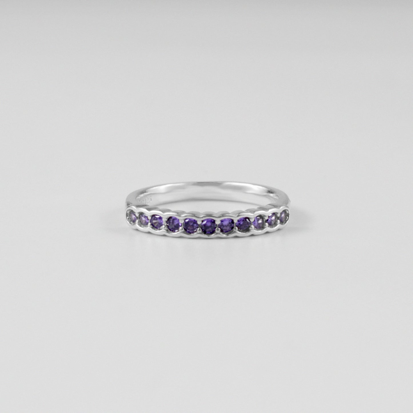 "925 sterling silver ring with a pebble-inspired design, symbolizing natural elegance, named 'Pebble Embrace Ring.'"