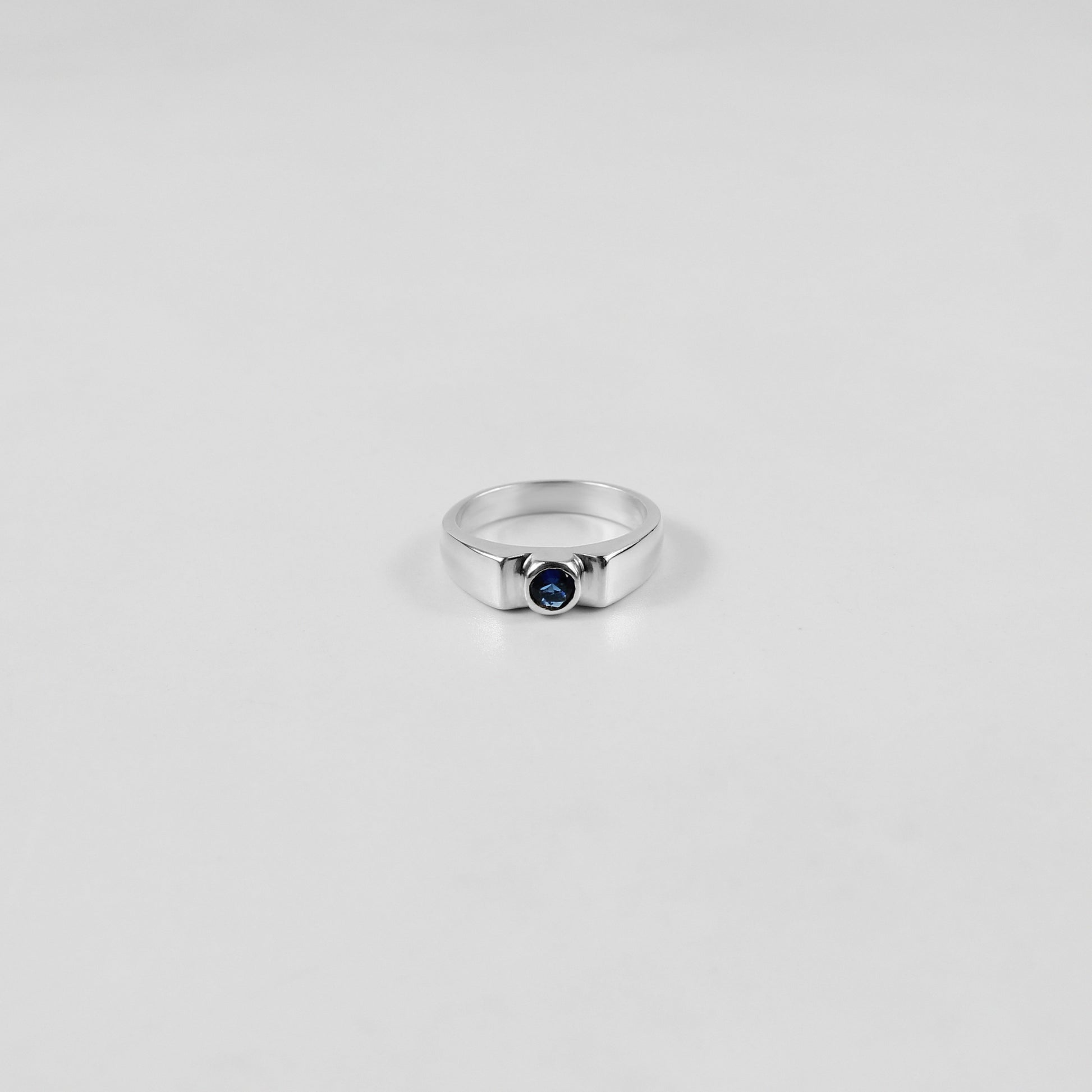 925 sterling silver ring featuring a classic design with a round white stone at its center, named 'White Round Stone Ring.