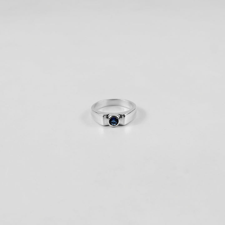 925 sterling silver ring featuring a classic design with a round white stone at its center, named 'White Round Stone Ring.