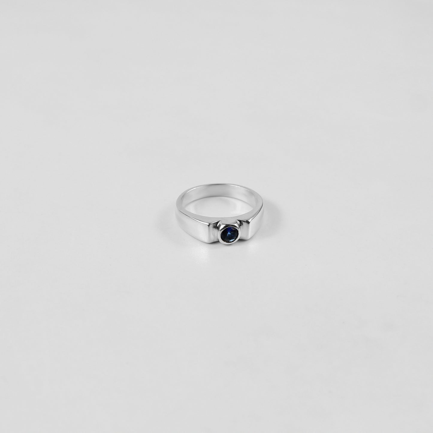 925 sterling silver ring featuring a classic design with a round white stone at its center, named 'White Round Stone Ring.