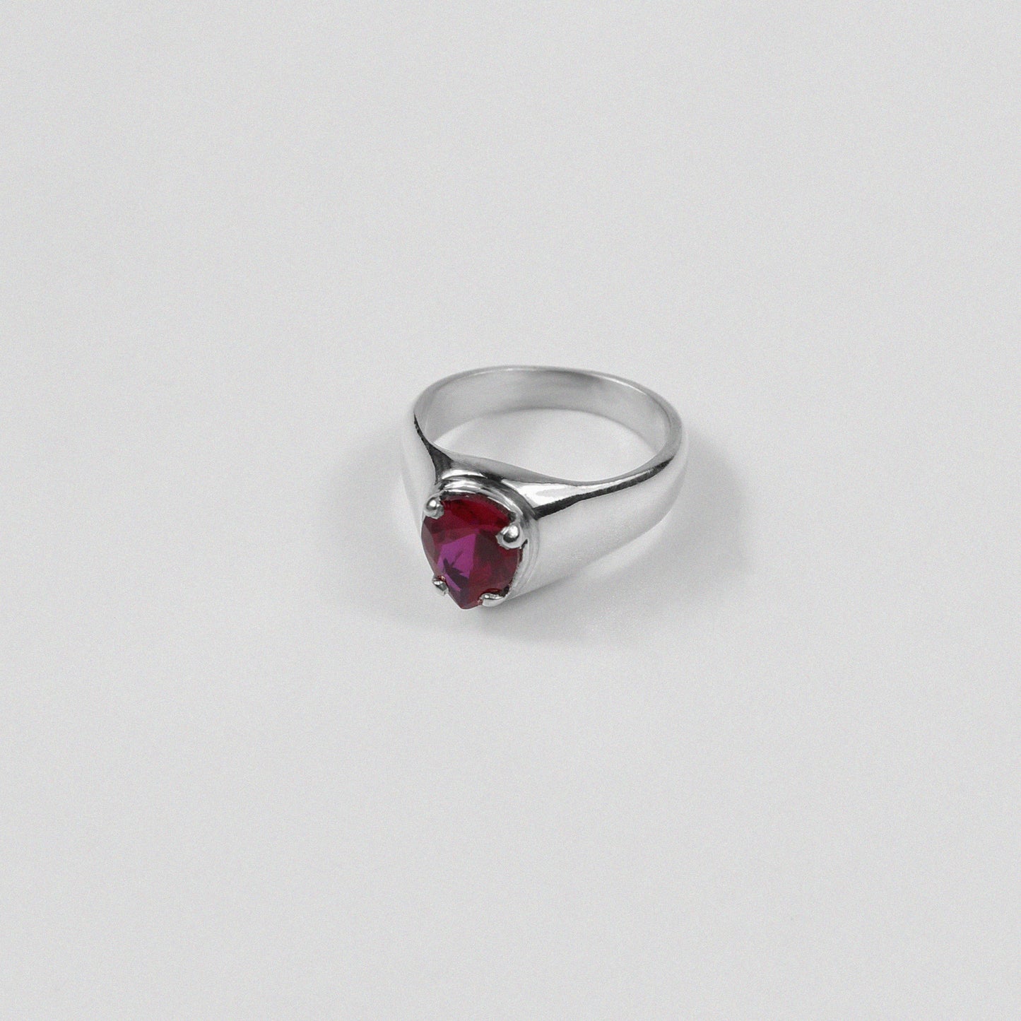 "925 sterling silver ring featuring a bold design with a striking red gemstone, named 'Scarlet Ring.'"