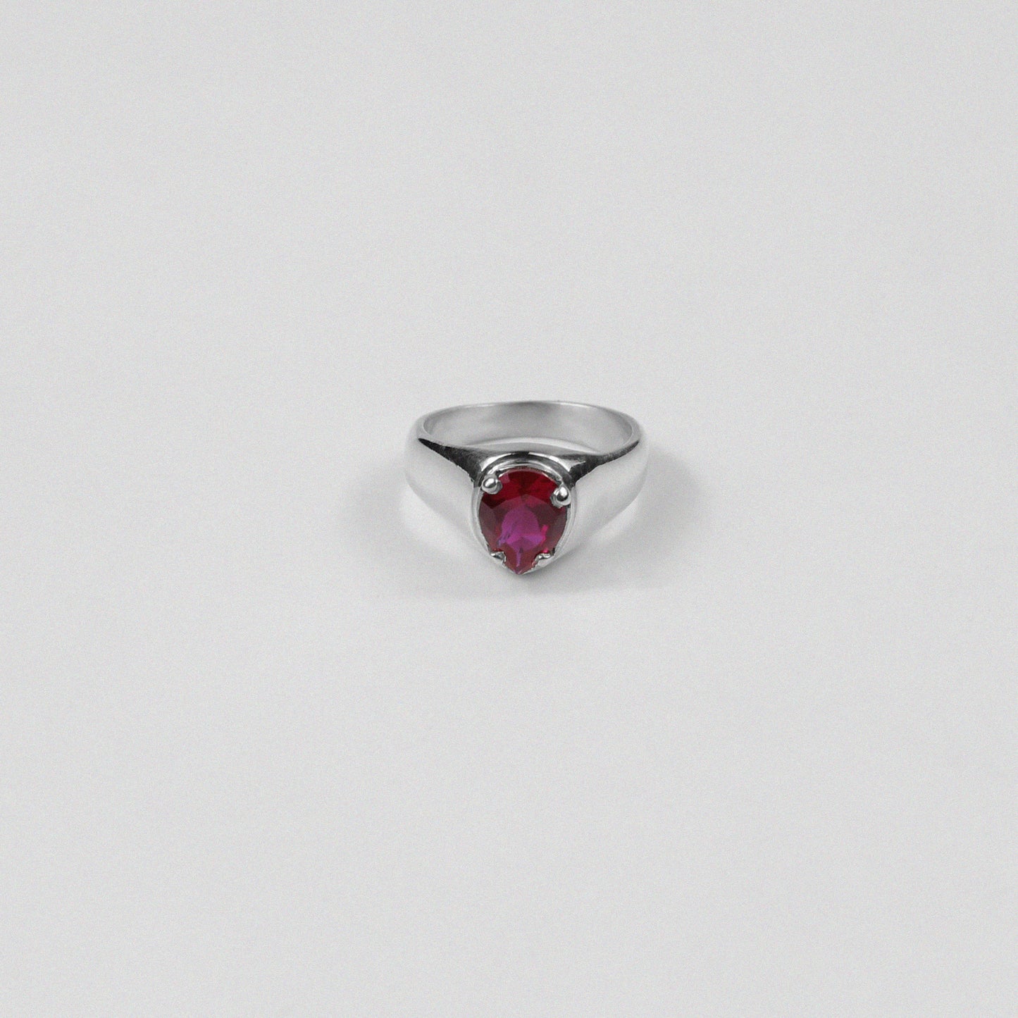 "925 sterling silver ring featuring a bold design with a striking red gemstone, named 'Scarlet Ring.'"