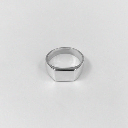 "925 sterling silver ring featuring a smooth, crest-inspired design, named 'Sleek Crest Ring.'"