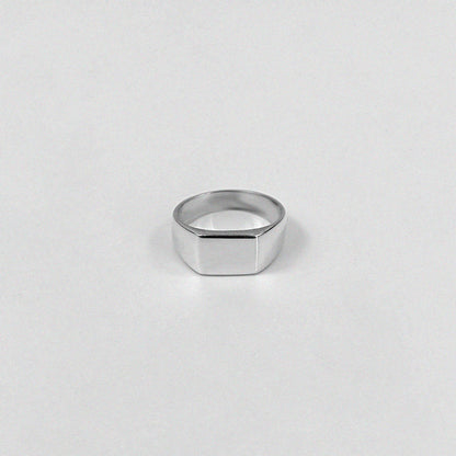 "925 sterling silver ring featuring a smooth, crest-inspired design, named 'Sleek Crest Ring.'"