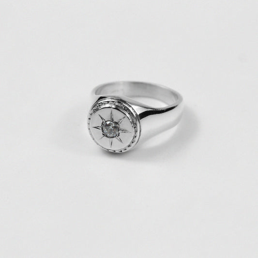 "925 sterling silver signet ring with a distinctive star-shaped design, named 'Star Signet Ring.'"