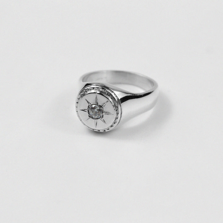 "925 sterling silver signet ring with a distinctive star-shaped design, named 'Star Signet Ring.'"