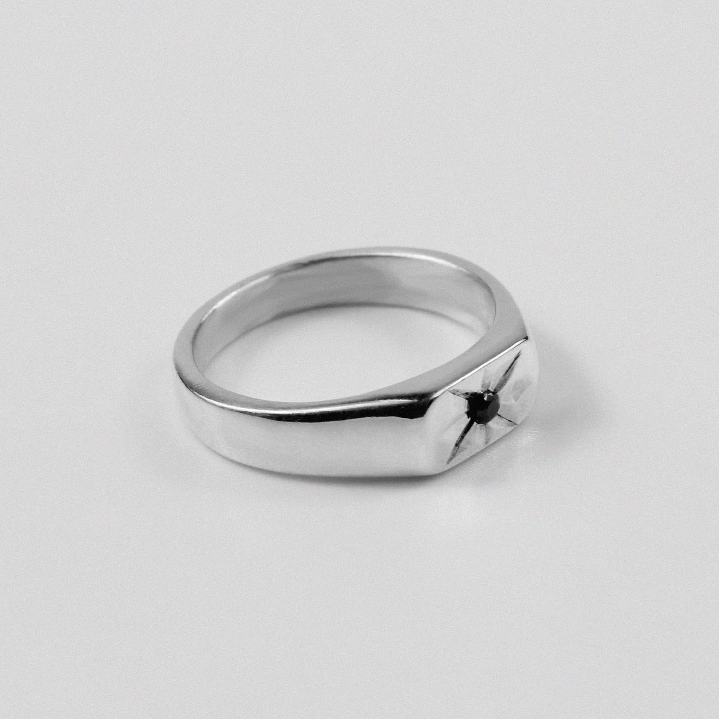 925 sterling silver signet ring featuring a thin design with a starburst pattern, named 'Thin Starburst Signet Ring.